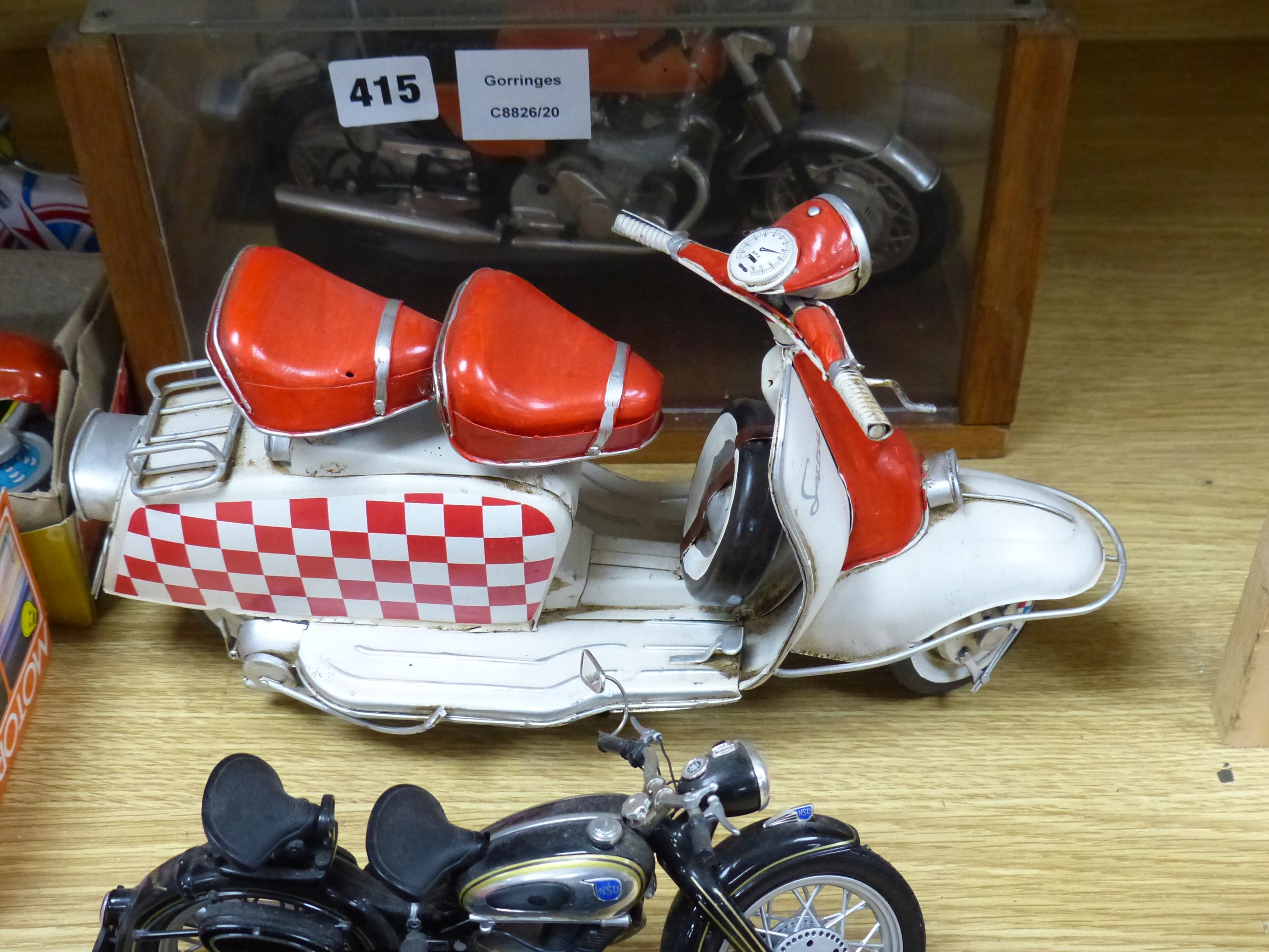 A collection of tinplate motorcycles etc